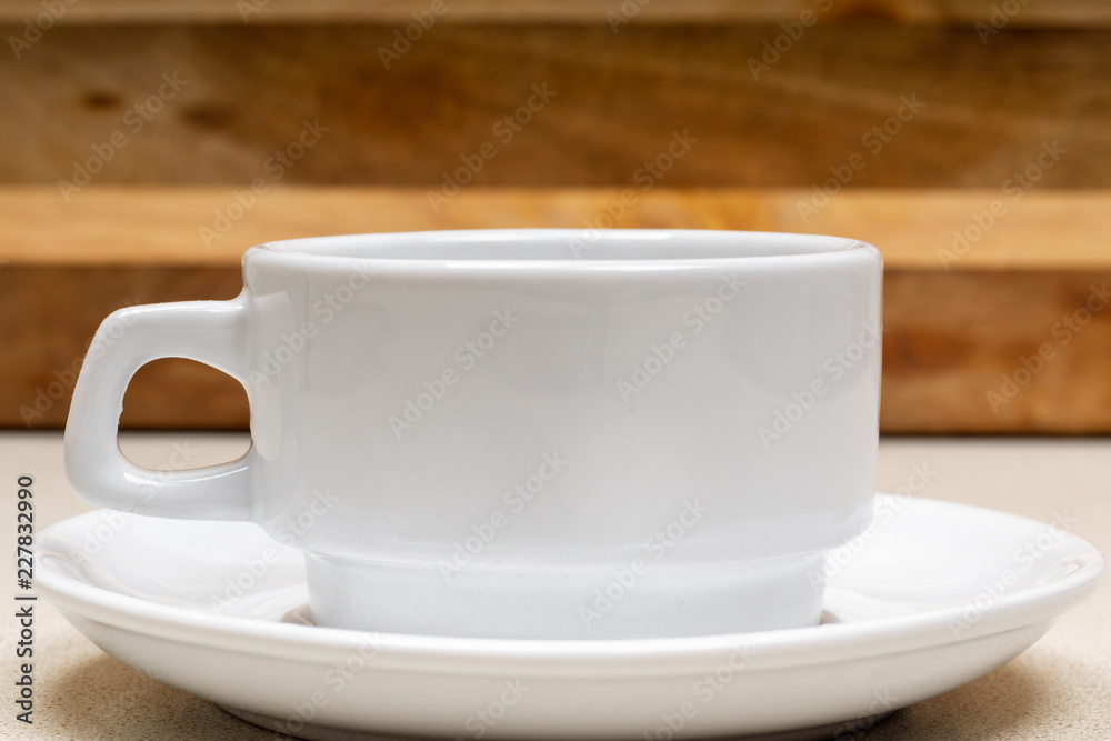 white cup of grain coffee on a saucer on the wooden background surface white cup of grain coffee on a saucer on the wooden background surface