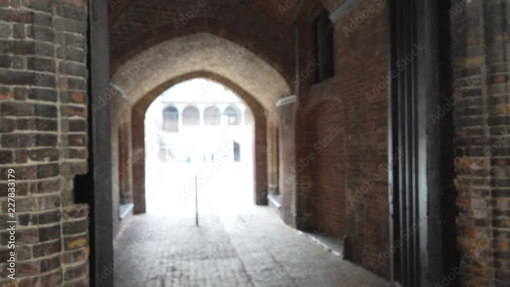 Out of focus background of exterior passageway in brick building for compositing