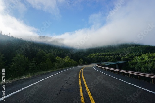 Morning drive on a foggy mountain road in Washington state   