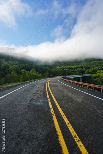 Morning drive on a foggy mountain road in Washington state   