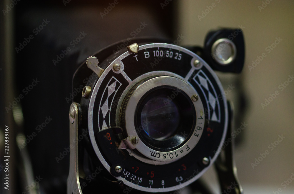 Old film camera on a black  background
