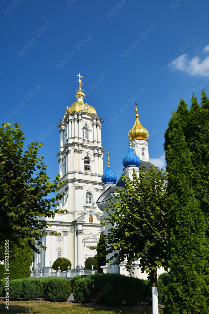 Religious buildings, Orthodox Christian cathedral with golden domes. Huge religious complex. Bell tower in Holy Dormition Pochayiv Lavra, Ukraine.