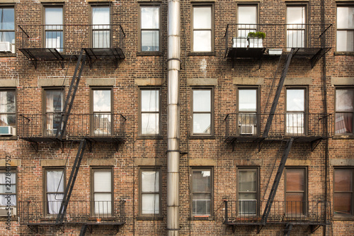 old brick building with fire escapes in front, Manhattan, New York
