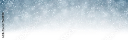 Grey blurred winter banner with snow.