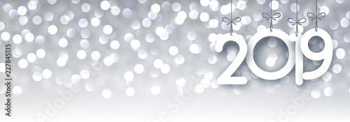 Grey shiny 2019 New Year bokeh banner.