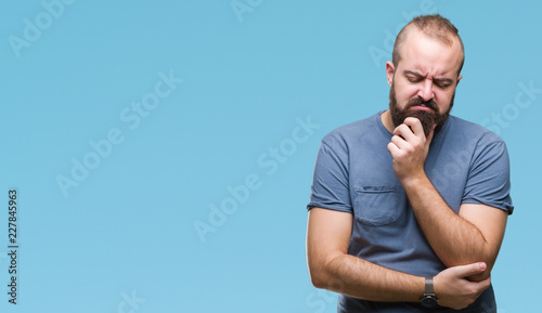 Young caucasian hipster man over isolated background thinking looking tired and bored with depression problems with crossed arms.