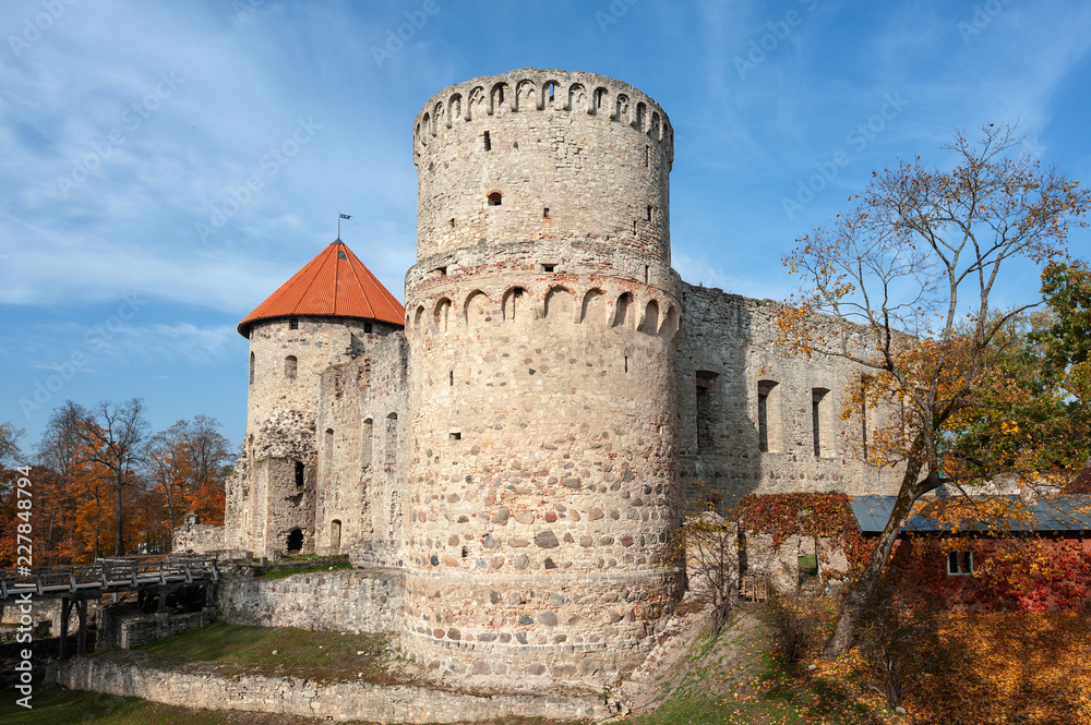 Watchtower and surrounding wall of castle ruins in Cesis town, Latvia