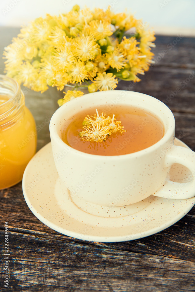 linden flowers herbal  Cup of healthy tea with honey. alternative or complementary medicine, traditional medicine. soft focus image 