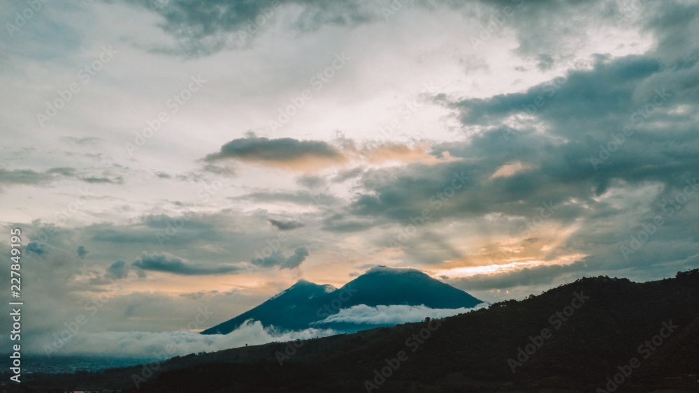 Aerial of Fuego and Acatenango volcanoes in Guatemala at sunset