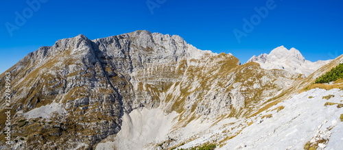 Panoramic view of the Julian Alps from the top of the Veliki Draski vrh mountain photo