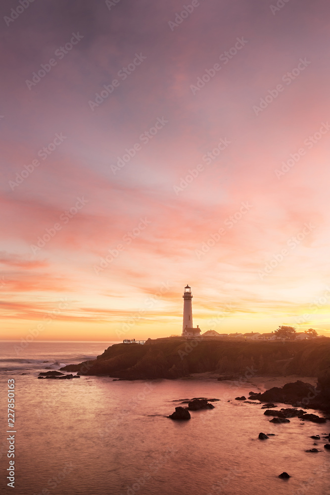 Pigeon Point lighthouse set against the setting sun Pigeon Point lighthouse set against the setting sun