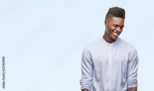 Young african american man over isolated background winking looking at the camera with sexy expression, cheerful and happy face.