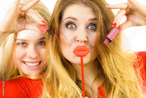 Two women and lip product