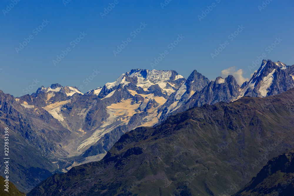View from Elbrus on the surrounding mountain peaks with snow and glaciers in the North Caucasus.