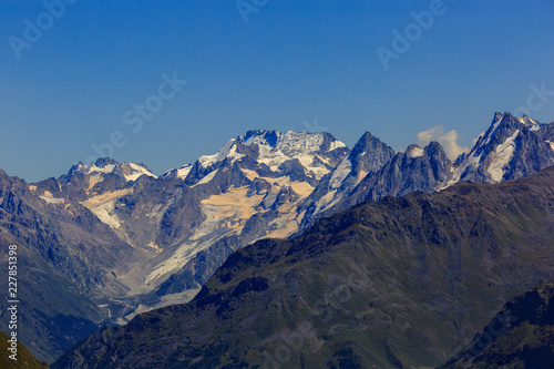 View from Elbrus on the surrounding mountain peaks with snow and glaciers in the North Caucasus.