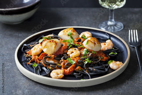 Vászonkép Squid ink pasta with prawns and scallops