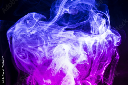 Colored smoke on black background