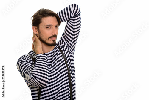 Studio shot of handsome man posingn against white background photo