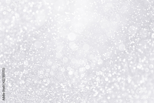 Silver and white snow confetti sparkle background