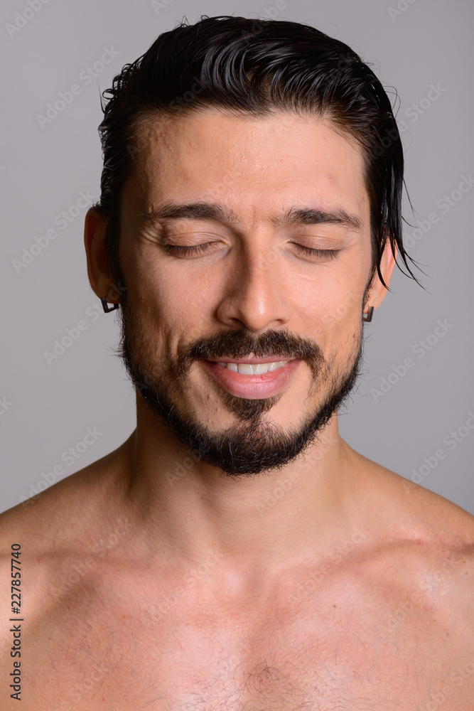 Face of happy handsome man smiling with eyes closed shirtless Face of happy handsome man smiling with eyes closed shirtless