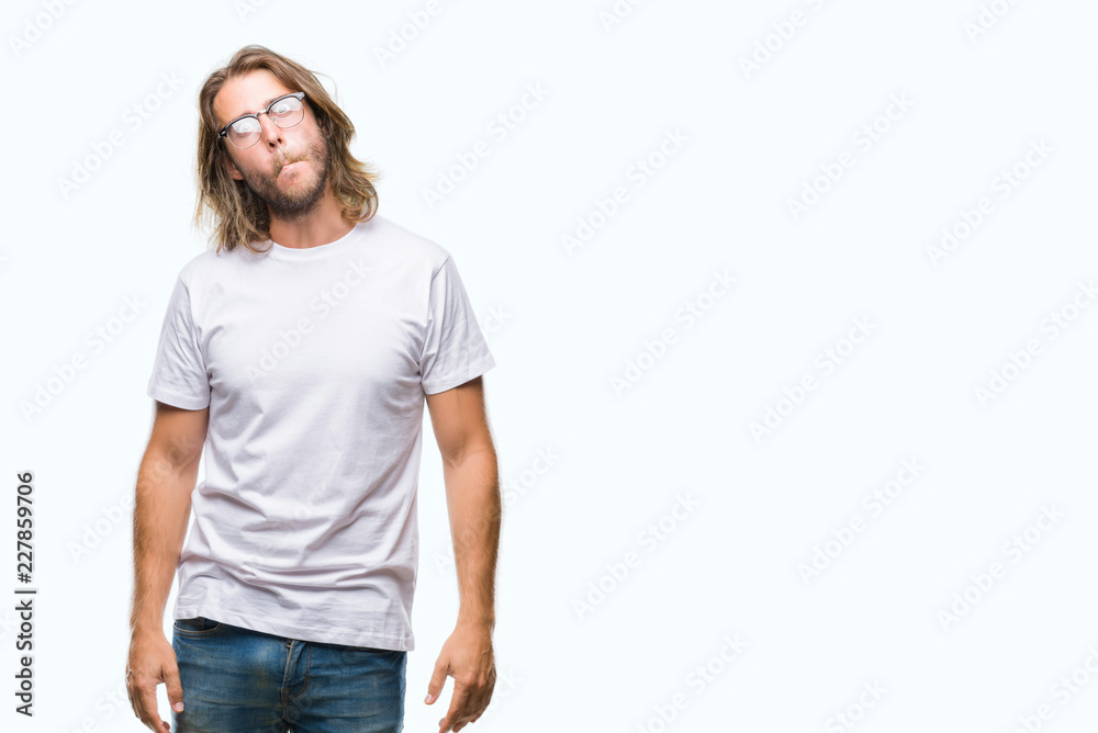 Young handsome man with long hair wearing glasses over isolated background making fish face with lips, crazy and comical gesture. Funny expression. Young handsome man with long hair wearing glasses over isolated background making fish face with lips, crazy and comical gesture. Funny expression.
