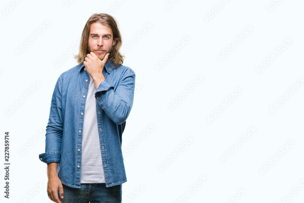 Young handsome man with long hair over isolated background looking confident at the camera with smile with crossed arms and hand raised on chin. Thinking positive. Young handsome man with long hair over isolated background looking confident at the camera with smile with crossed arms and hand raised on chin. Thinking positive.