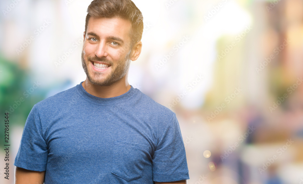 Young handsome man over isolated background looking away to side with smile on face, natural expression. Laughing confident. Young handsome man over isolated background looking away to side with smile on face, natural expression. Laughing confident.