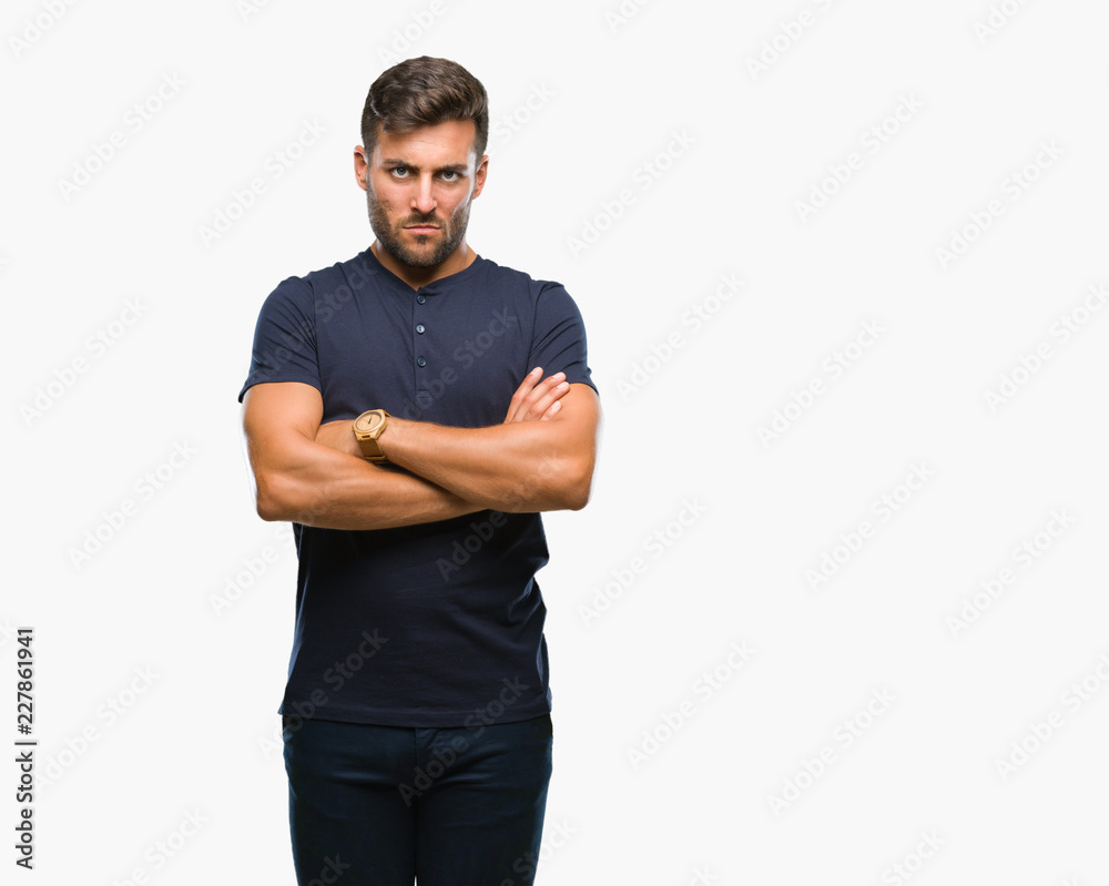Young handsome man over isolated background skeptic and nervous, disapproving expression on face with crossed arms. Negative person. Young handsome man over isolated background skeptic and nervous, disapproving expression on face with crossed arms. Negative person.