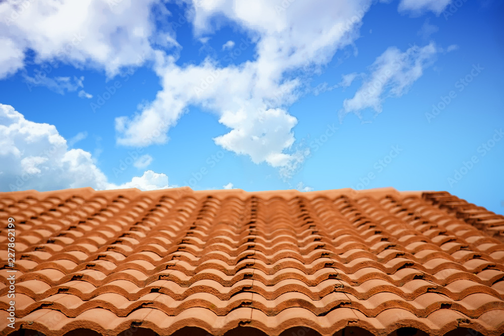 Roof of Red Clay Tiles Under Cloudy Skies