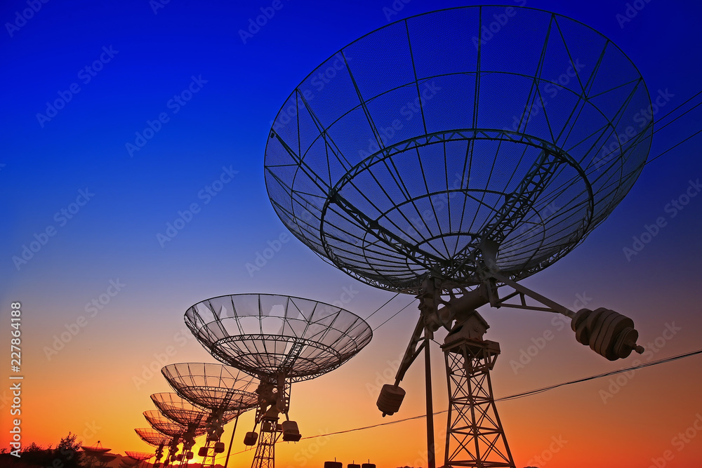 The silhouette of a radio telescope observatory The silhouette of a radio telescope observatory