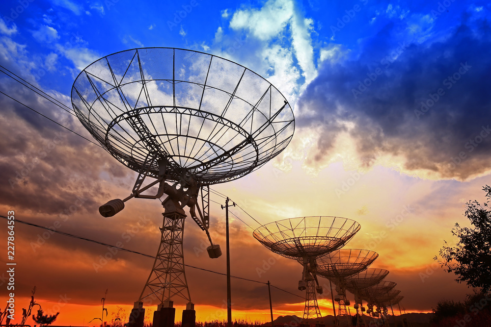 The silhouette of a radio telescope observatory The silhouette of a radio telescope observatory
