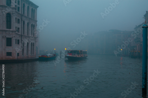 Water taxi on a foggy morning in Venice Italy