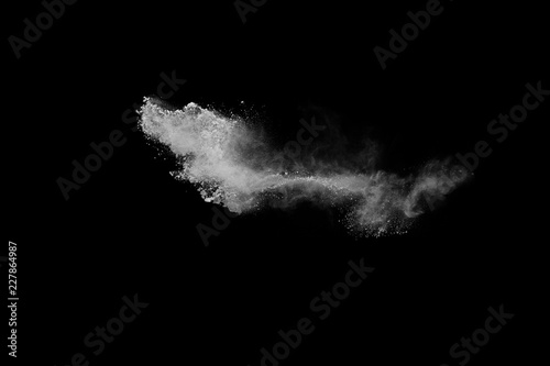 White powder isolated on black background.
