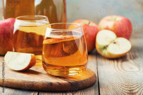 Canvas Print Organic Apple cider or juice on a wooden table