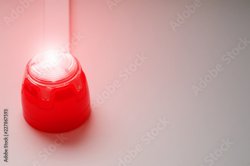 Red flashing emergency light. Fire alarm system. Sound and light alert.