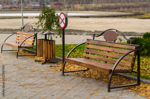 Sign, symbol, non-Smoking place, with benches in the Park under construction for tourism and recreation photo