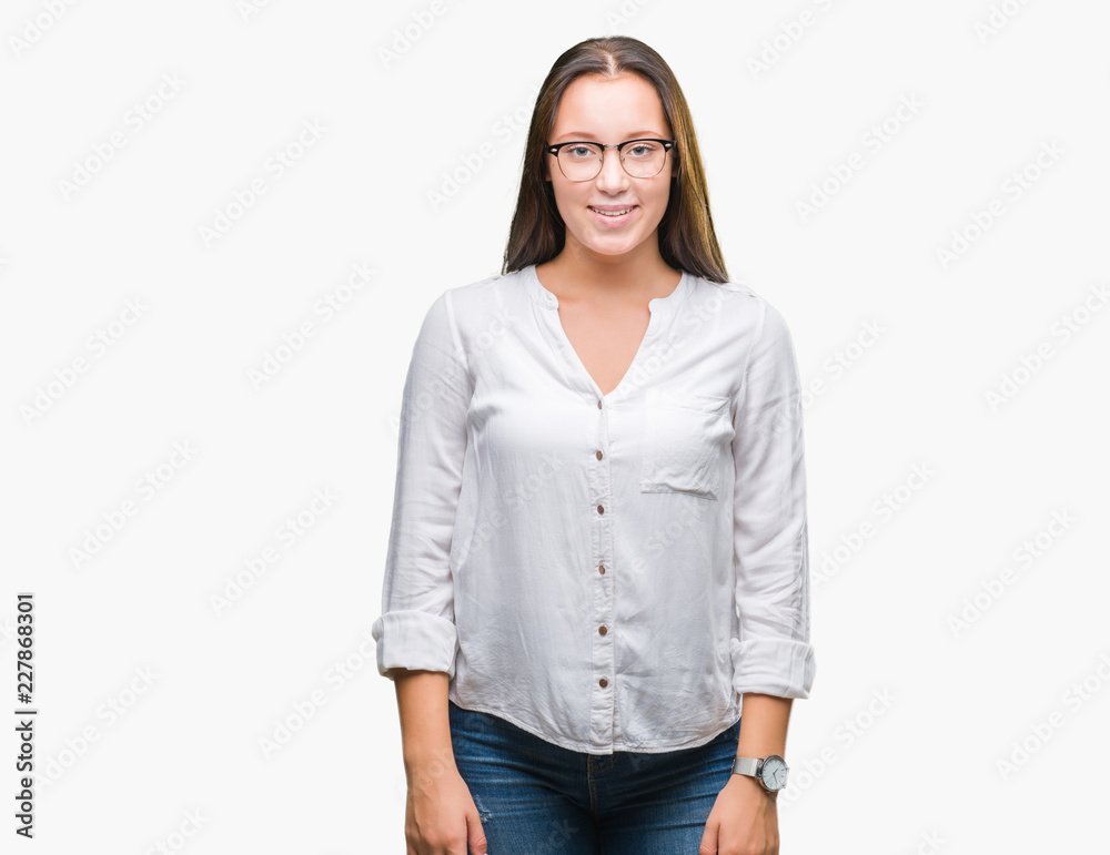 Young caucasian beautiful business woman wearing glasses over isolated background with a happy and cool smile on face. Lucky person. Young caucasian beautiful business woman wearing glasses over isolated background with a happy and cool smile on face. Lucky person.