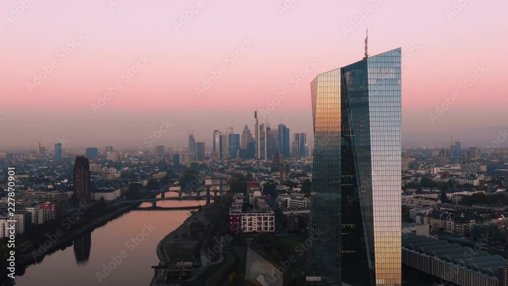 Frankfurt ECB Skyline Aerial Shot at early sunrise reflecting sun
