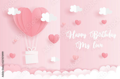 Birthday card concept with heart balloons in the sky, Valentine's and wedding card in paper cut style vector illustration.