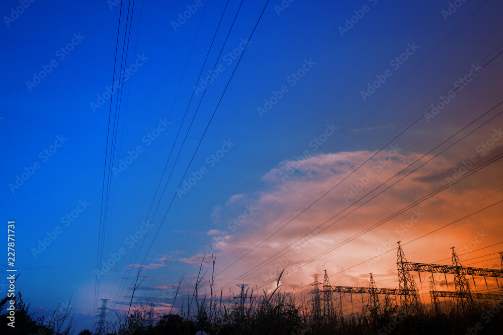 Electricity power station,Power distribution system to sunset sky background.
