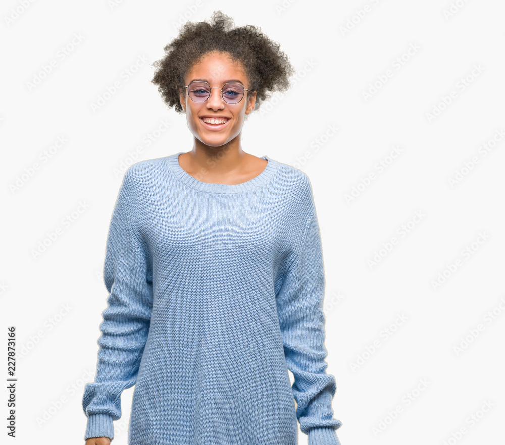 Young afro american woman wearing glasses over isolated background with a happy and cool smile on face. Lucky person. Young afro american woman wearing glasses over isolated background with a happy and cool smile on face. Lucky person.