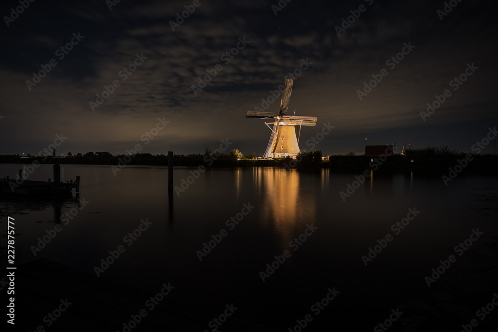 the windmills in Kinderdijk are illuminated