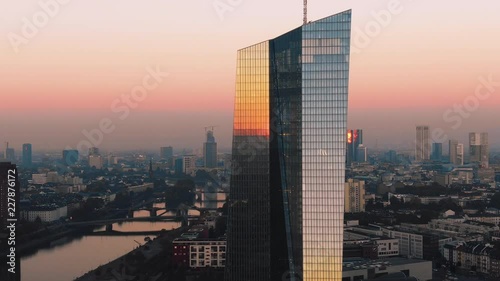 Frankfurt ECB Skyline Aerial Shot at early sunrise reflecting sun photo