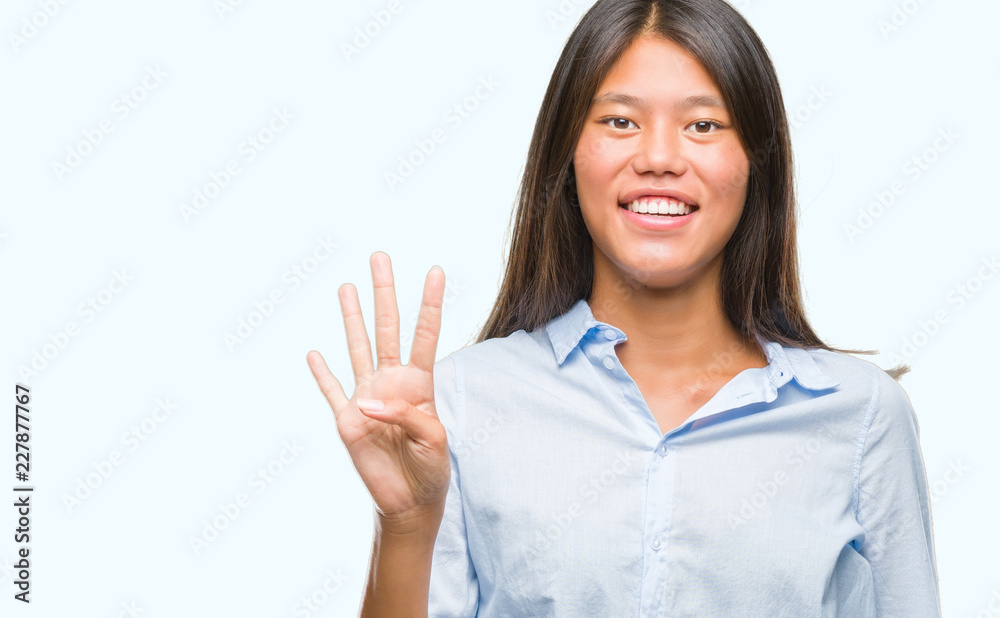 Young asian business woman over isolated background showing and pointing up with fingers number four while smiling confident and happy. Young asian business woman over isolated background showing and pointing up with fingers number four while smiling confident and happy.