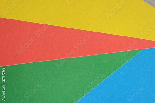Background and texture of multicolored sheets of cardboard close up