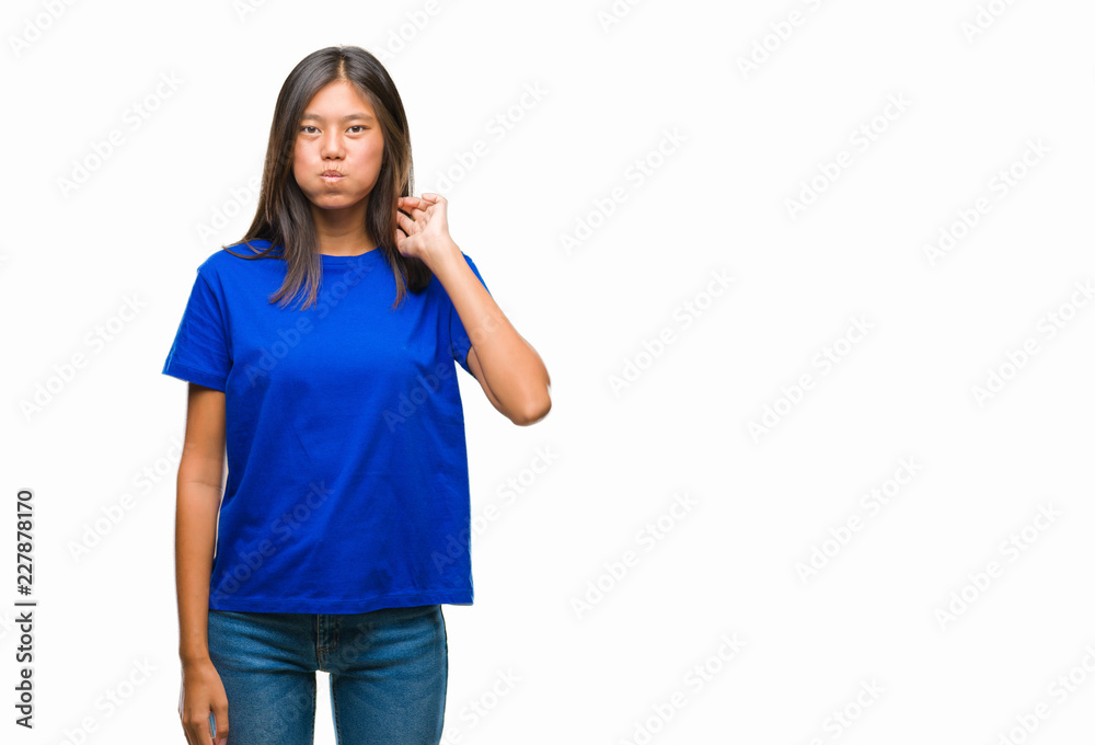 Young asian woman over isolated background puffing cheeks with funny face. Mouth inflated with air, crazy expression.