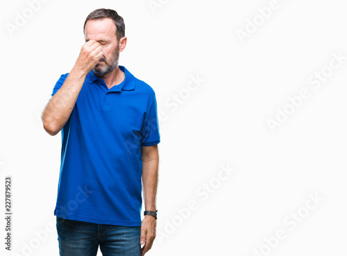 Middle age hoary senior man over isolated background tired rubbing nose and eyes feeling fatigue and headache. Stress and frustration concept.