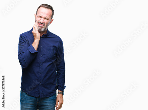 Middle age hoary senior man over isolated background touching mouth with hand with painful expression because of toothache or dental illness on teeth. Dentist concept.