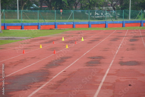 Artificial track and field with green grass combined with artificial grass