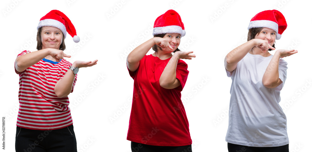 Collage of down sydrome woman wearing christmas hat over isolated background amazed and smiling to the camera while presenting with hand and pointing with finger. Collage of down sydrome woman wearing christmas hat over isolated background amazed and smiling to the camera while presenting with hand and pointing with finger.